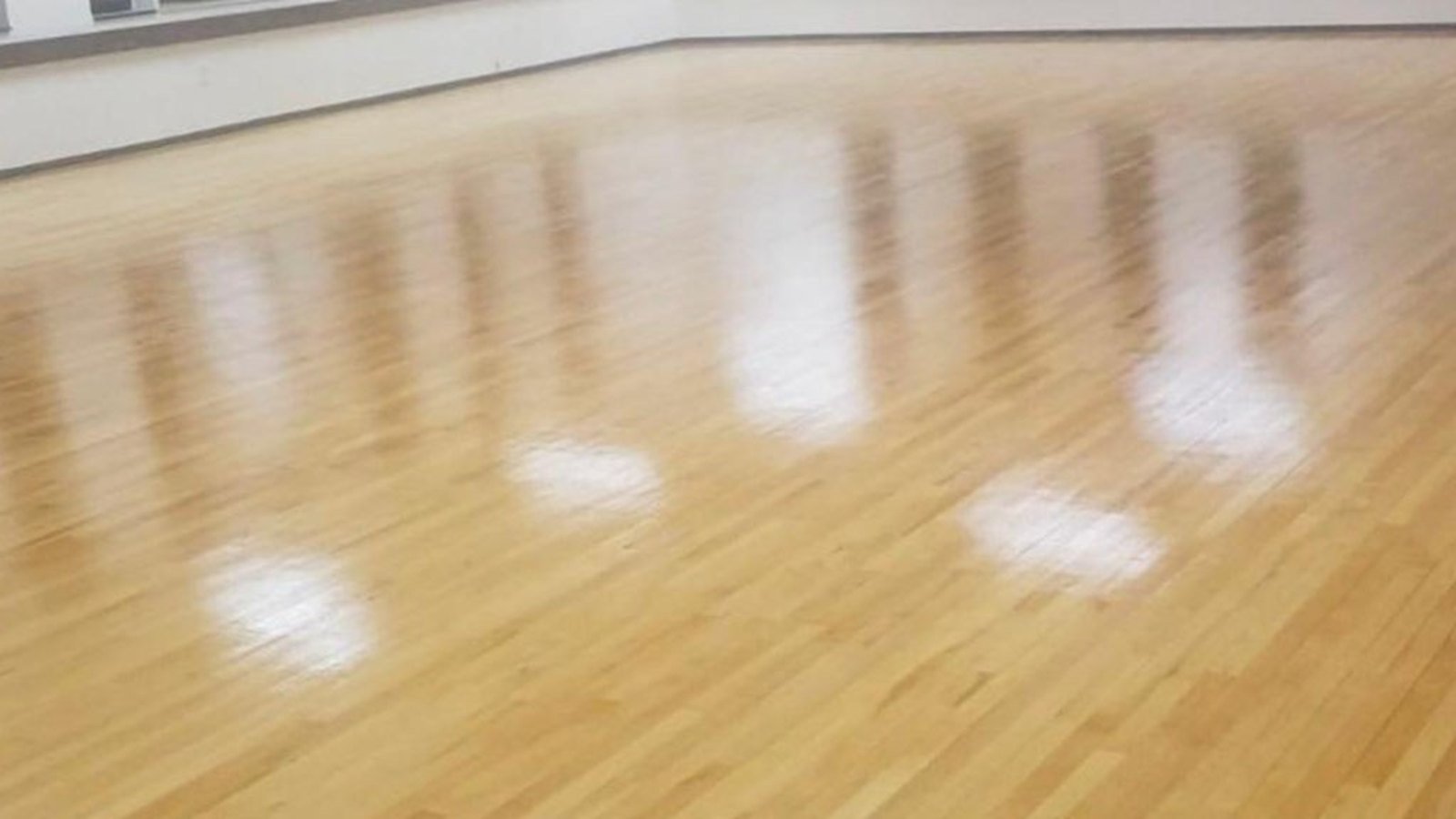 Hardwood floor buff and recoat service by F&S Hardwood Floors restoring shine to a Denver metro home